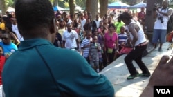 Liberian singer Friday the Cell Phone Man entertains Liberians during independence day festivities in Washington, DC