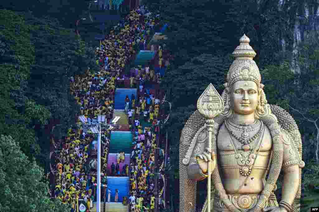 Hindu devotees climb the 272 steps to the Batu Caves temple to make offerings during the Thaipusam festival at Batu Caves on the outskirts of Kuala Lumpur, Malaysia.