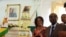 Zimbabwean President Robert Mugabe and his wife, Grace, stand next to his birthday cake at State House in Harare, Monday, Feb. 22, 2016. Office staff in the president's office organized a surprise birthday celebration ahead of bigger birthday celebration set for Saturday in the southern town of Masvingo. (AP Photo/Tsvangirayi Mukwazhi)