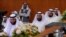 FILE - Abdullah al-Barghash, second from left, returns to parliamentary session after walking out in protest of two female cabinet members that were not dressed according to strict Islamic codes, Kuwait, June 1, 2008.