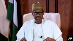 In this photo released by the Nigeria State House, Nigeria's President Muhammadu Buhari looks on during a broadcast to the Nation at the Presidential palace in Abuja, Nigeria, Aug. 21, 2017. 