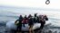 Migrants arrive at the village of Skala Sikaminias, on the Greek island of Lesbos, after crossing on a dinghy the Aegean sea from Turkey, March 2, 2020.