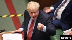 Britain's Prime Minister Boris Johnson speaks during question period at the House of Commons in London, July 8, 2020.