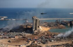 FILE - A general view shows the damaged grain silos of Beirut's harbor and its surroundings on Aug. 5, 2020, one day after a powerful twin explosion tore through Lebanon's capital.