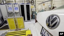 FILE - A 2013 Volkswagen Passat with a diesel engine is evaluated at the California Air Resources Board emissions test lab in El Monte, Calif. 