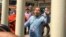 Political analyst Kim Sok appeared at the court February 17, 2017. He was charged and sent to a pre-trial detention following hours of questioning by Cambodian prosecutors. (Hean Socheata/VOA Khmer)