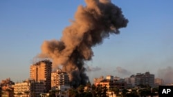 Smoke rises from a building hit in an Israeli airstrike in Tyre, southern Lebanon, Nov. 16, 2024. 