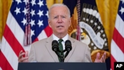 US President Joe Biden speaks about the July jobs report during an event in the East Room of the White House, Aug. 6, 2021, in Washington. 