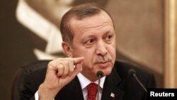 FILE - Turkey's Prime Minister Recep Tayyip Erdogan talks to the media in Istanbul.