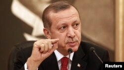 FILE - Turkey's Prime Minister Recep Tayyip Erdogan talks to the media in Istanbul.