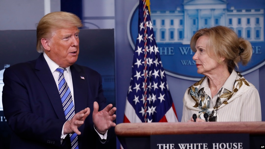 FILE - President Donald Trump asks a question of Dr. Deborah Birx, White House coronavirus response coordinator, during a briefing about the coronavirus in the James Brady Briefing Room, March 23, 2020, in Washington.