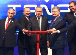 Turkey's President Recep Tayyip Erdogan, center, attends the opening ceremony of Trans-Anatolian Natural Gas Pipeline, a key pipeline that will carry natural gas from Azerbaijan's gas fields to Turkish markets.