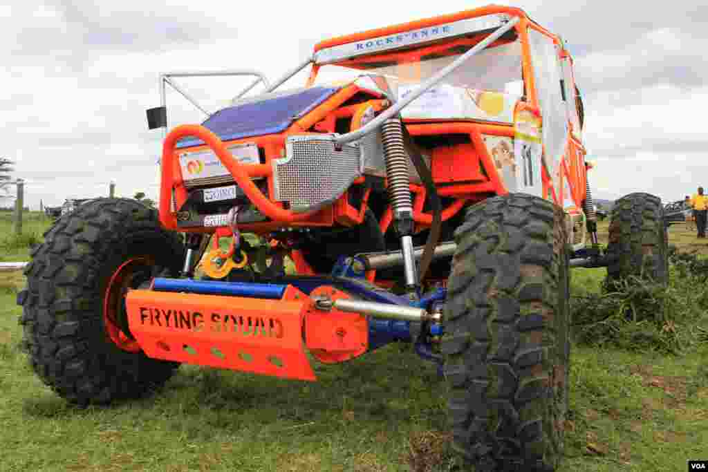 The 62 off-road "charge cars" in this year's Rhino Charge range from a stately green Land Rover to this imposing neon orange monstrosity named "Rocks' Anne." "Rocks&rsquo; Anne" was made in the U.S. state of Michigan and shipped to Kenya for the Rhino Charge. (J. Craig/VOA)