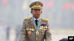 FILE - Myanmar's Commander-in-Chief Senior General Min Aung Hlaing presides an army parade on Armed Forces Day in Naypyitaw, Myanmar, March 27, 2021. 