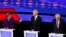 La precandidata demócrata Elizabeth Warren se dirige al exvicepresidene Joe Biden y al senador Bernie Sanders durante el séptimo debate realizado el 14 de enero en Des Moines, Iowa. Foto REUTERS