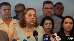 Corina Yoris, would-be presidential candidate for Venezuela's main opposition coalition, speaks to the media in Caracas on March 25, 2024. The Unity Platform coalition says that election officials did not let it register Yoris as its candidate by the deadline to do so.
