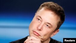 FILE - Elon Musk listens at a press conference following the first launch of a SpaceX Falcon Heavy rocket at the Kennedy Space Center in Cape Canaveral, Florida, U.S., Feb. 6, 2018. 