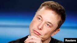 FILE - Elon Musk listens at a press conference following the first launch of a SpaceX Falcon Heavy rocket at the Kennedy Space Center in Cape Canaveral, Fla., Feb. 6, 2018. 