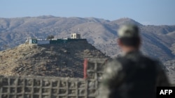 FILE - A Pakistani army soldier stands guard on a border terminal in Ghulam Khan, a town in North Waziristan, on the border between Pakistan and Afghanistan, Jan. 27, 2019. 