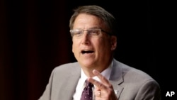 FILE - North Carolina Gov. Pat McCrory comments on House Bill 2 while speaking during a government affairs conference in Raleigh, North Carolina, May 4, 2016. 