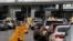 Cars line up to cross into the U.S. at the Mexico-U.S. San Ysidro border crossing, in Tijuana, Mexico, March 19, 2020.
