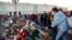 People mourn as they lay flowers in memory of the plane crash victims at Dvortsovaya (Palace) Square in St. Petersburg, Russia.