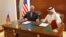 Qatar's foreign minister Sheikh Mohammed bin Abdulrahman al-Thani (R) and U.S. Secretary of State Rex Tillerson sign a memorandum of understanding in Doha, Qatar, July 11, 2017.