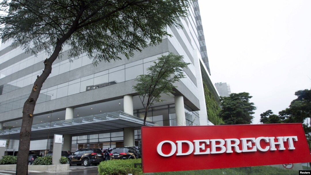 Federal police cars are parked in front of the headquarters of Odebrecht, a large private Brazilian construction firm, in Sao Paulo, Brazil, June 19, 2015.