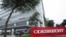 Federal police cars are parked in front of the headquarters of Odebrecht, a large private Brazilian construction firm, in Sao Paulo, Brazil, June 19, 2015. 