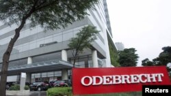 Federal police cars are parked in front of Odebrecht headquarters in Sao Paulo, Brazil, June 19, 2015. 