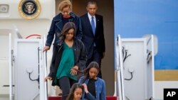 President Barack Obama exits Air Force One with his family, March 25, 2016, at Andrews Air Force Base, Md. 