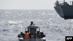 FILE - Nigerian special forces sail to intercept pirates during a joint exercise between Nigerian and Moroccan naval personels as part of Obangame Express, a multinational maritime exercise involving dozens of countries off the coast of Lagos, March 20, 2019.