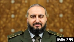 The interim Syrian government's defense minister Murhaf Abu Qasra is seen in Damascus in this handout picture released Jan. 6, 2025.