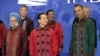 President Barack Obama stands with China's Premier Wen Jiabao, center, as they wait to take a family photo at the East Asia Summit Gala dinner in Nusa Dua, on the island of Bali, Indonesia, November 18, 2011.