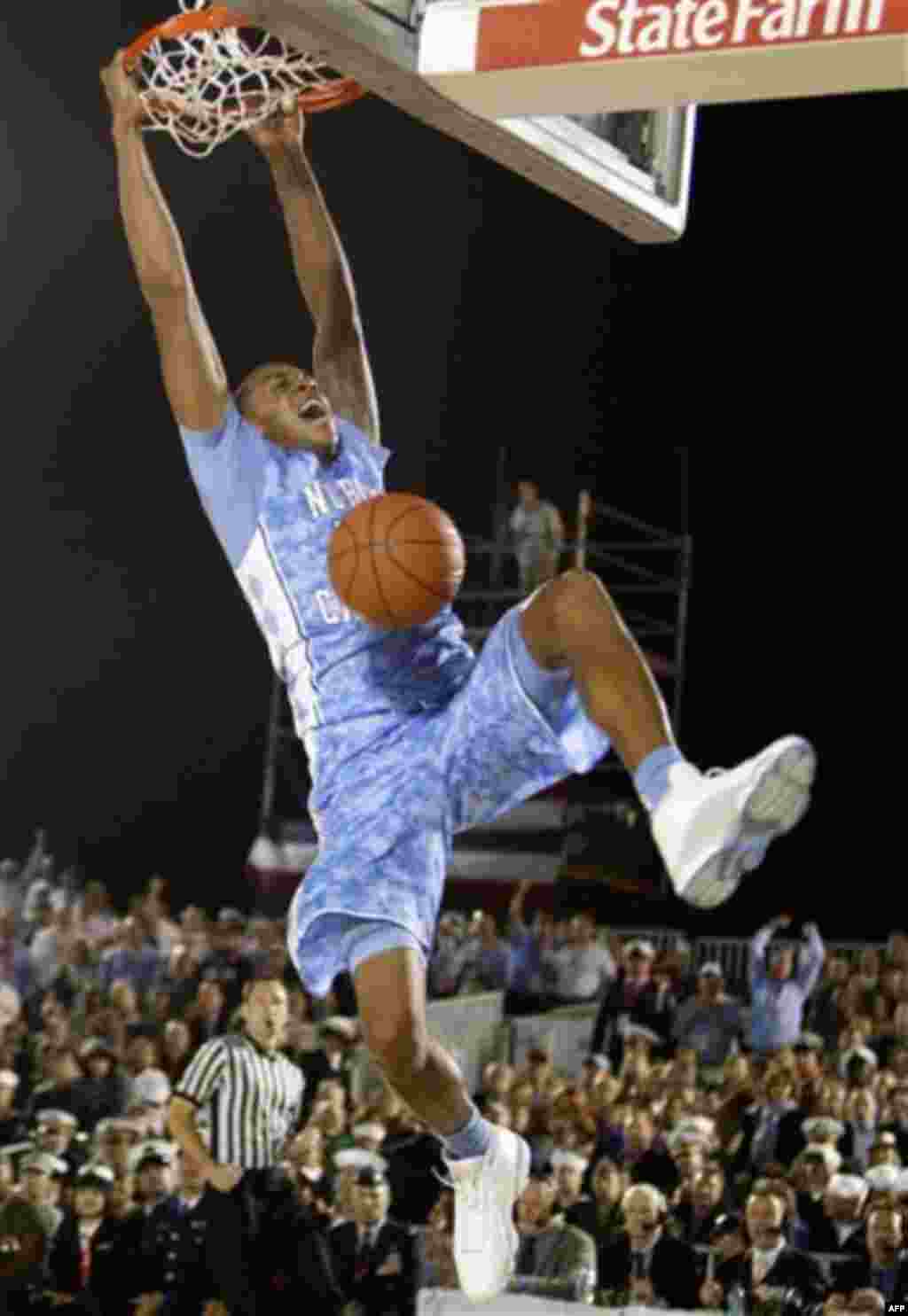 North Carolina forward John Henson (31) dunks during the first half of the Carrier Classic NCAA college basketball game against Michigan State aboard the USS Carl Vinson, Friday, Nov. 11, 2011, in Coronado, Calif. (AP Photo/Lenny Ignelzi)