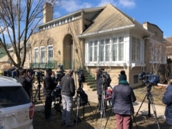 FILE - Journalists gather in front of the home of Patti Blagojevich, wife of former Illinois Gov. Rod Blagojevich, in the Ravenswood neighborhood of Chicago, Feb. 18, 2020.