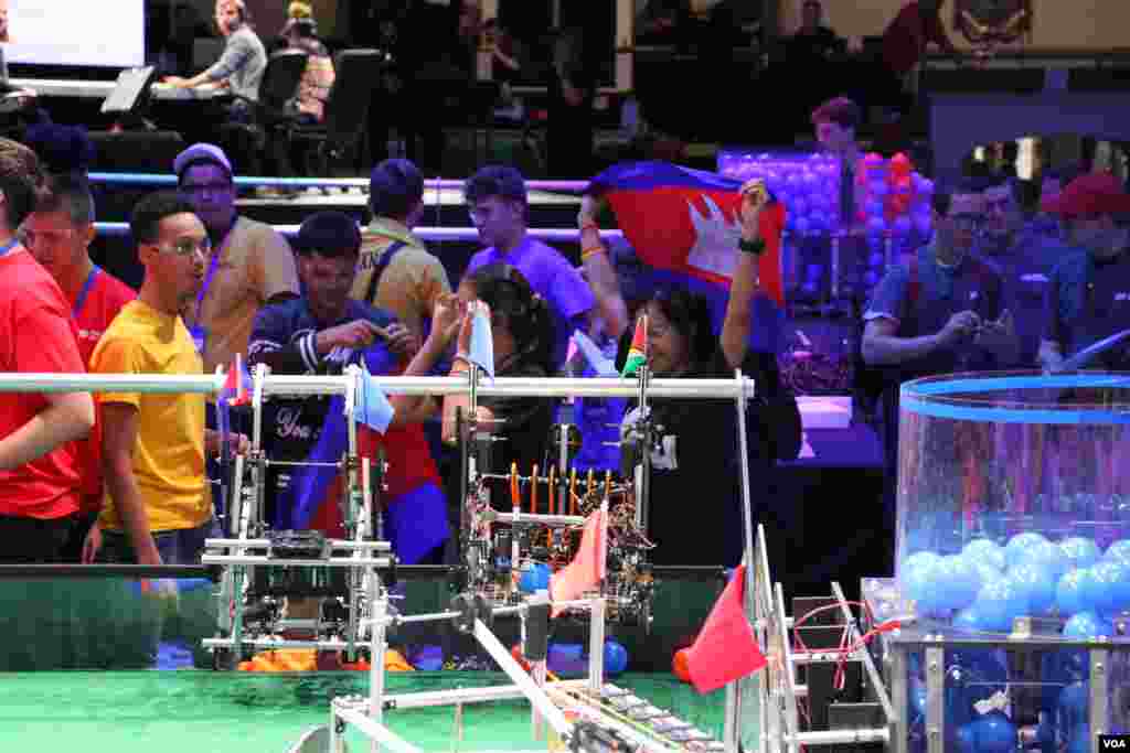 Members of the Cambodian robotics team celebrate after winning their first competition during the First Global Challenge robotics competition in Washington, DC, Sunday, July 17, 2017. (Nem Sopheakpanha/VOA Khmer)