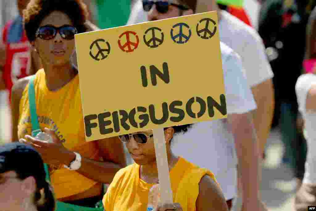 Demonstrators march together to protest the shooting death of Michael Brown on Aug. 23, 2014 in Ferguson, Missouri.