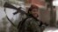 A Taliban fighter patrols in Wazir Akbar Khan in the city of Kabul, Afghanistan, Wednesday, Aug. 18, 2021. 