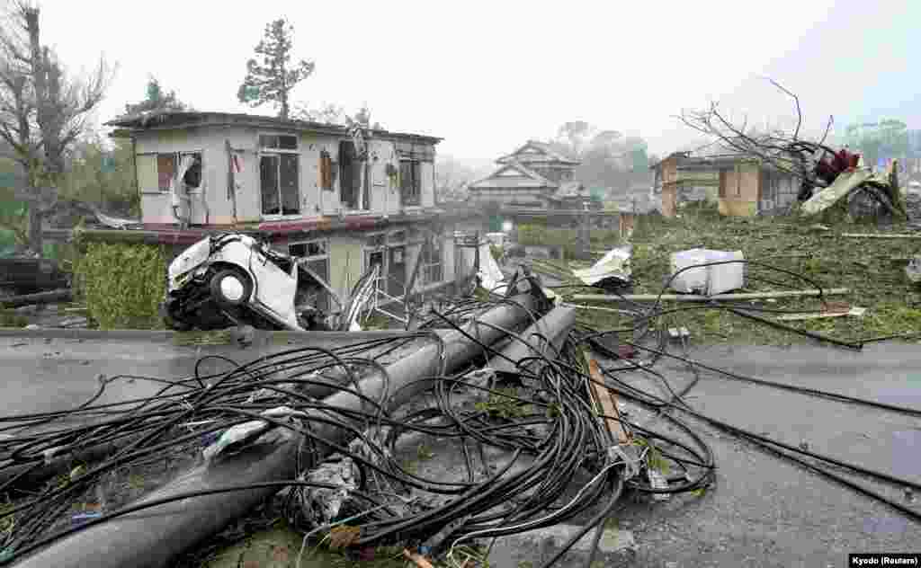 Destroyed houses, cars and power poles, which according to local media were believed to be caused by a tornado, are seen as Typhoon Hagibis approaches the Tokyo area in Ichihara, east of Tokyo, Japan, Oct. 12, 2019.