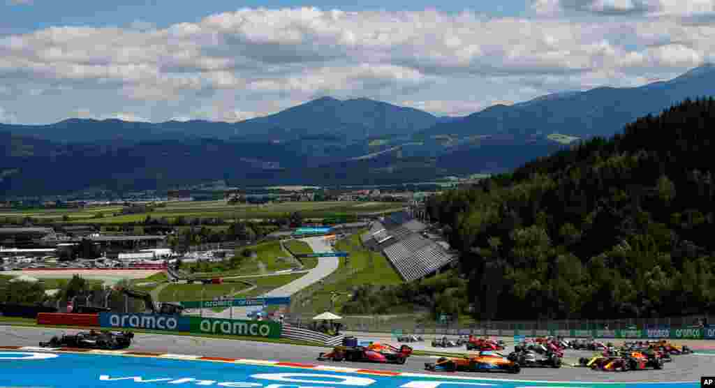 Mercedes driver Lewis Hamilton of Britain, left, leads during the Styrian Formula One Grand Prix race at the Red Bull Ring racetrack in Spielberg, Austria.