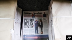 The front page of the Evening Standard displays the news of US President Donald Trump after he tested positive to Covid-19, in London, Oct. 2, 2020.