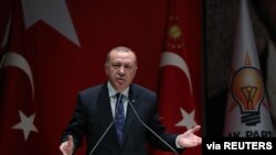 Turkish President Tayyip Erdogan speaks during a meeting of his ruling AK Party in Ankara, Turkey, Dec. 26, 2019. 