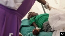 A patient suffering from HIV is taken to a local hospital in Harare, January 31, 2012. 