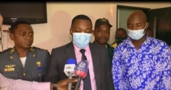 Harouna Nyandji Mgbatou (center, talking) is a senior government official, a division officer in Yaounde’s first district, July 22, 2021. (Moki Edwin Kindzeka/VOA)