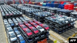 FILE - BYD electric cars wait to be loaded on a ship at Suzhou Port in China's eastern Jiangsu province, Sept. 11, 2023. Over the past year, companies such as EV giant BYD have made inroads in markets from Southeast Asia to Latin America and Africa. 