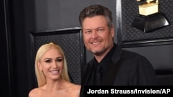 FILE - Gwen Stefani, left, and Blake Shelton arrive at the 62nd annual Grammy Awards in Los Angeles. 