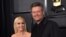 FILE - Gwen Stefani, left, and Blake Shelton arrive at the 62nd annual Grammy Awards in Los Angeles. 