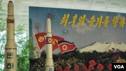 A model of the "Unha-9" missile on display at a floral exhibition in Pyongyang (Credit: Steve Herman / VOA News 26 July, 2013 Pyongyang)