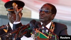 FILE: Zimbabwe's President Robert Mugabe is seen addressing a crowd in Harare August 12, 2013.